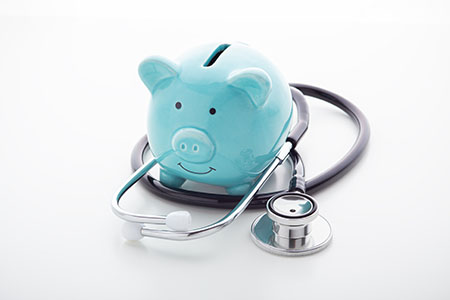 piggy bank with doctor stethoscope because short term health insurance is more affordable