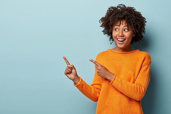 Woman pointing to the right